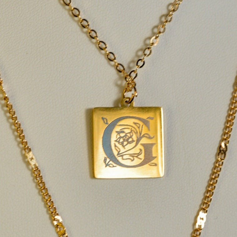 Stunning Gold Layered Necklace With Initial Engraving And Gem