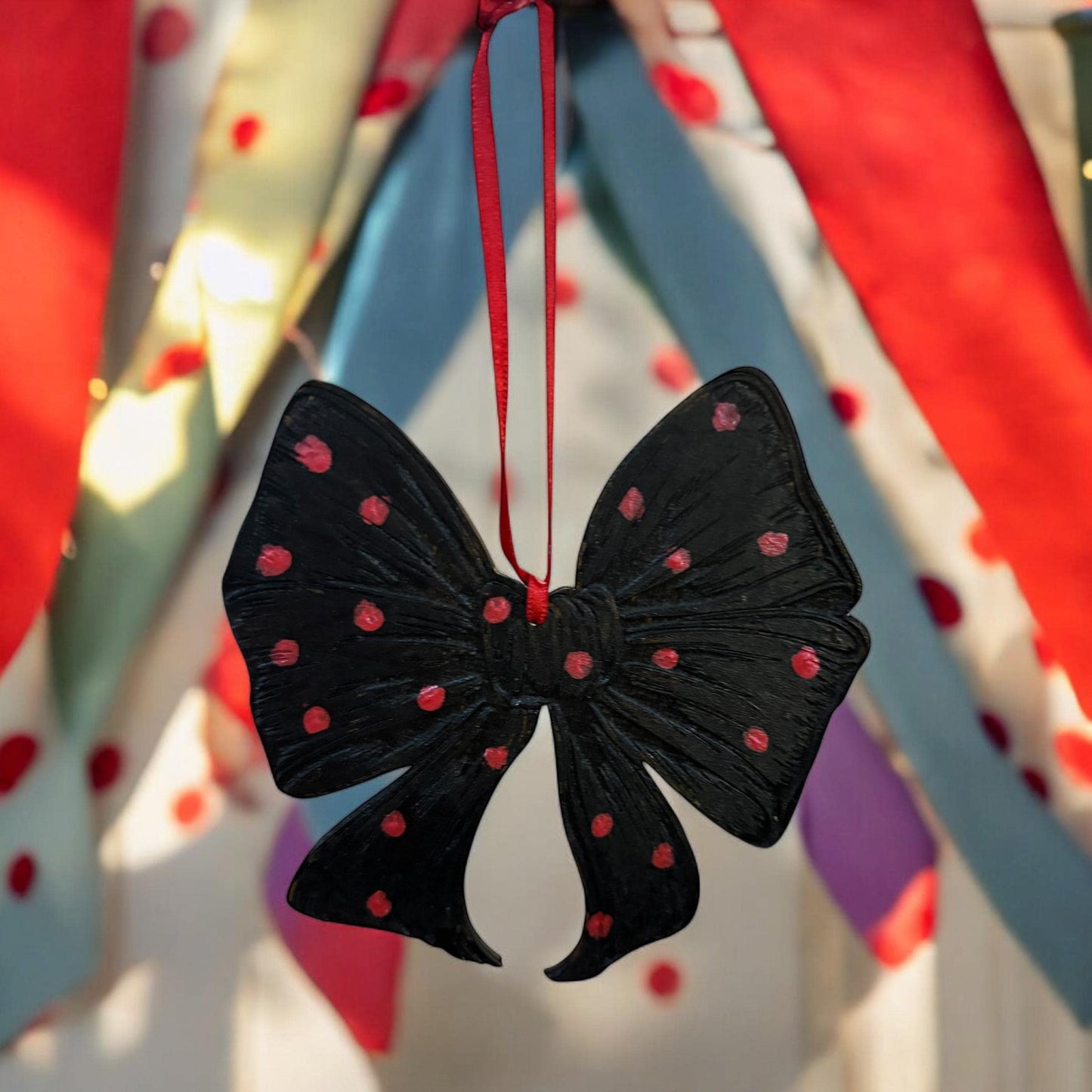 Hand-Painted Wooden Bow Ornament: Black and Red Spotted Decor
