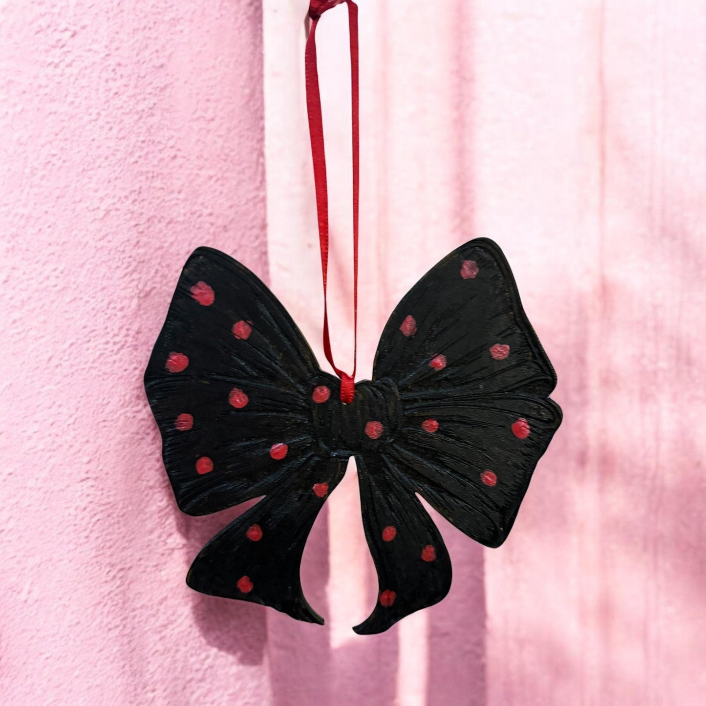 Hand-Painted Wooden Bow Ornament: Black and Red Spotted Decor